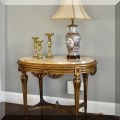 F44. Marble top oval table. 31"h x 40"w x 27"d 